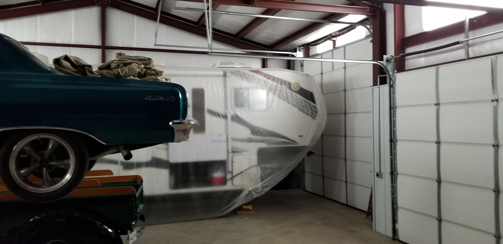 Garage Interior with Cars and Camper