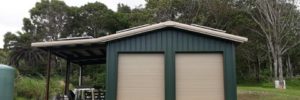 Dark Green-Blue Garage with Overhang