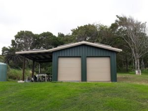 Dark Green-Blue Garage with Overhang